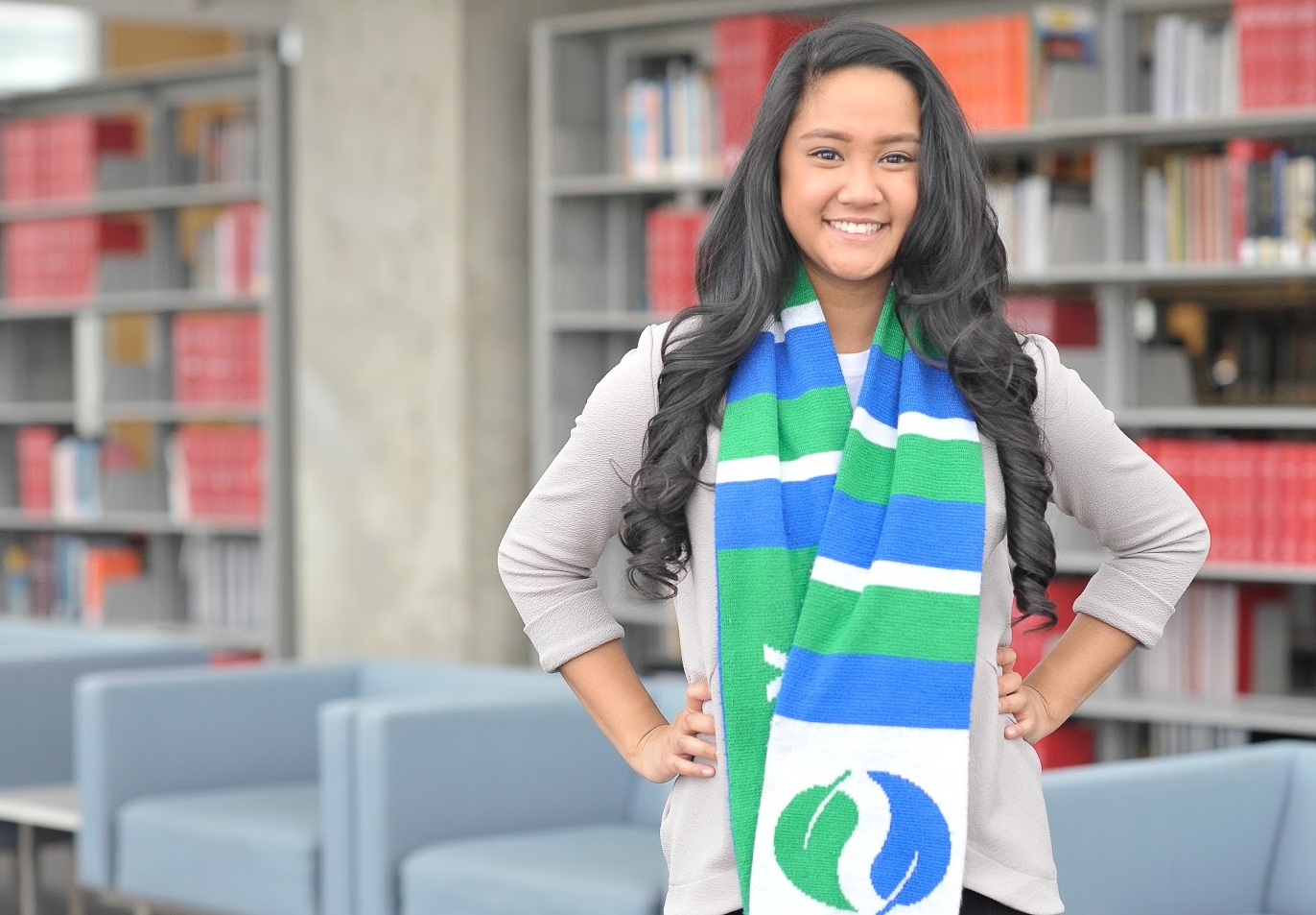 Alex Zamoria smiling and wearing a Schulich scarf